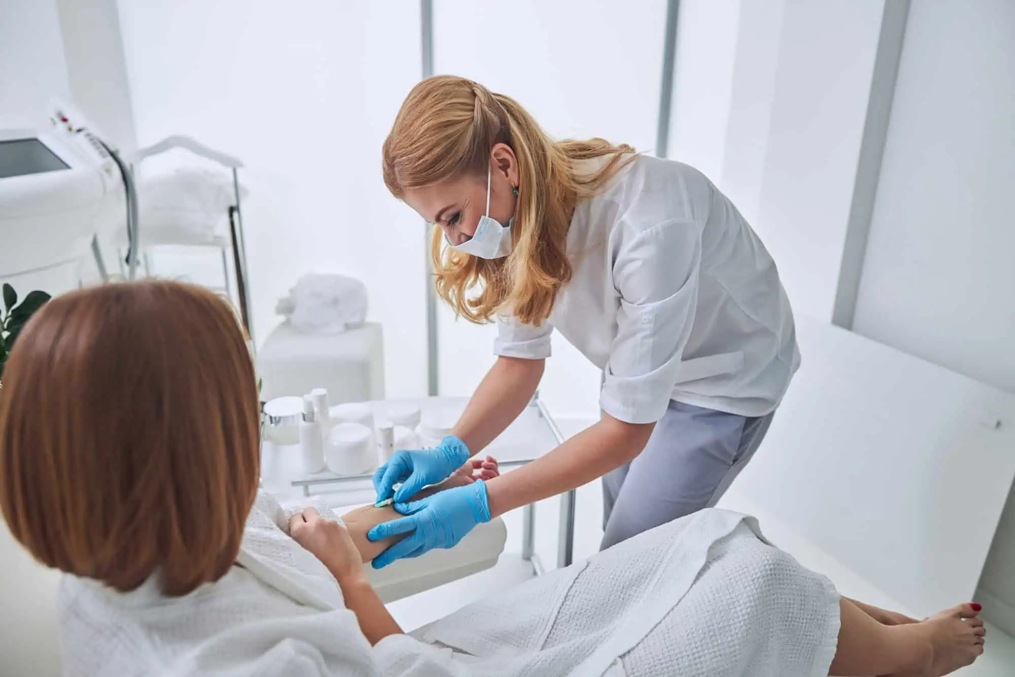 Aesthetician giving vitamin injectables to a patient in santee, ca by The Wellness Co.